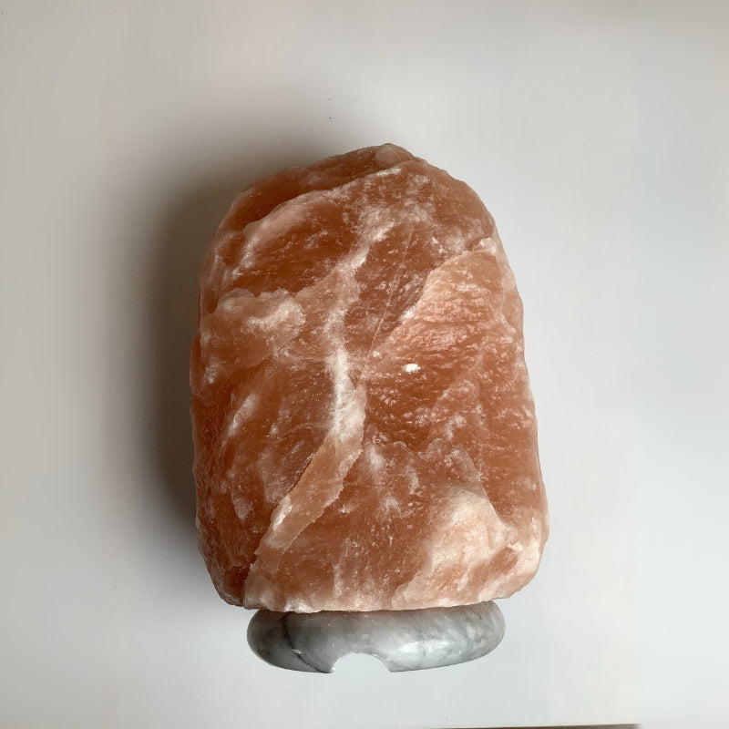 Warm glowing Himalayan salt lamp featuring dimmer