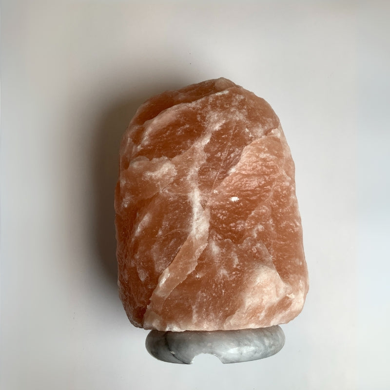 Himalayan salt lamp emitting warm light with dimmer control