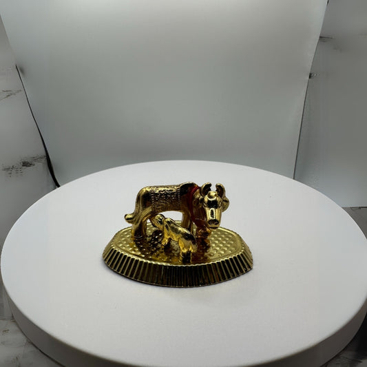Elegant cow sculpture in bronze finish