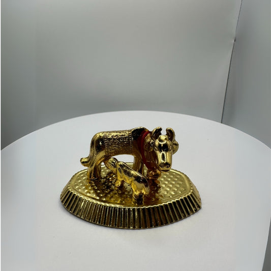 Decorative cow sculpture with detailed features
