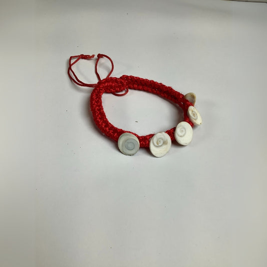Red thread bracelet with white Gomti Chakra